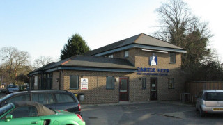 A brick veterinary clinic with a sign reading  A brick veterinary clinic with a sign reading