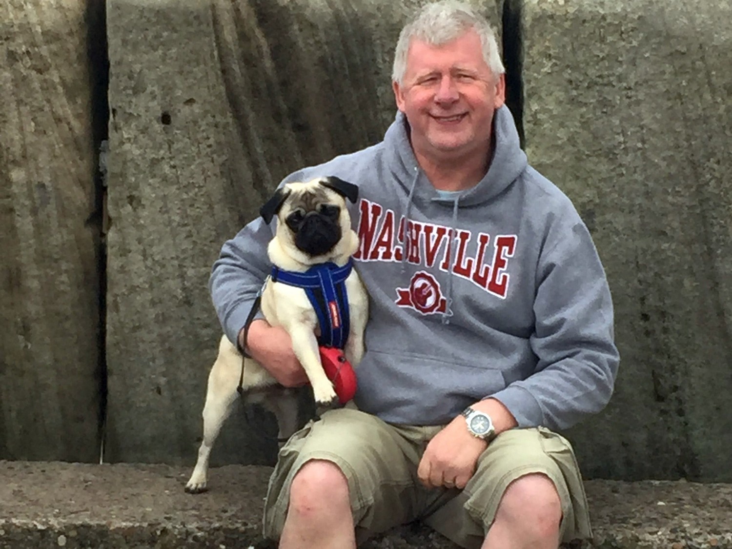 A man wearing a gray 