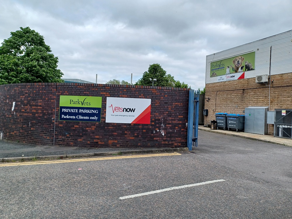 Brick wall displaying signs stating  Brick wall displaying signs stating