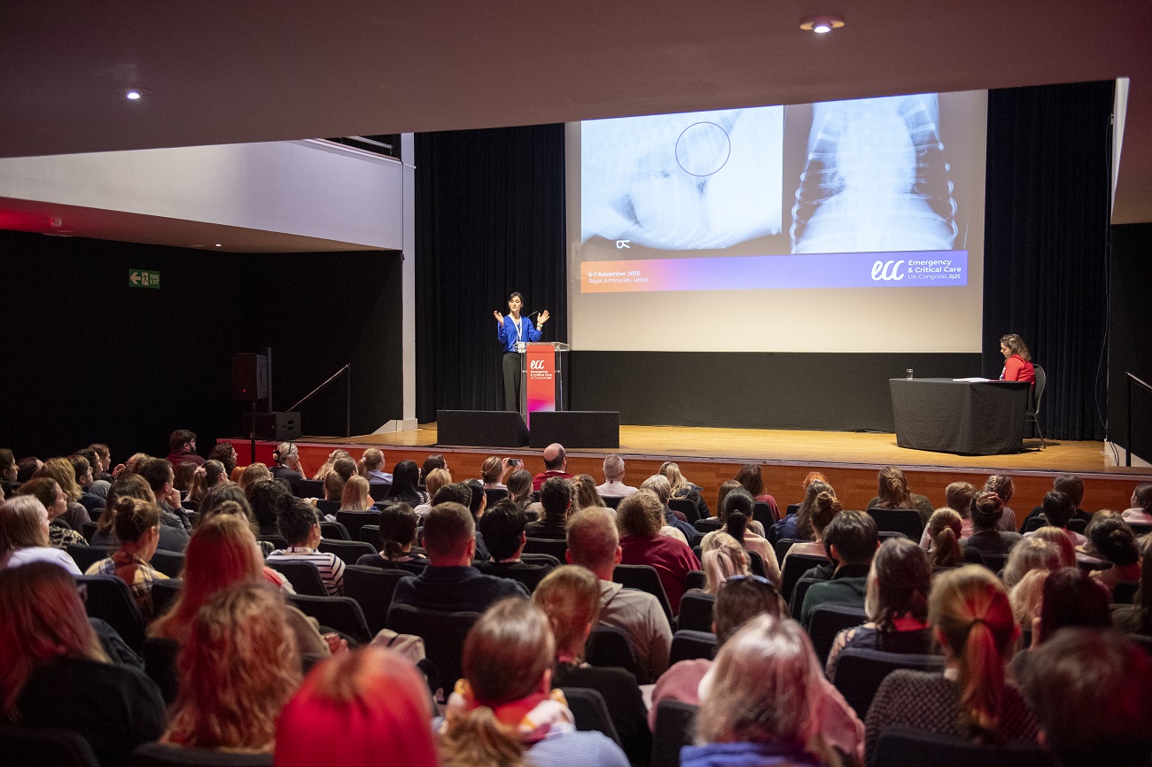 Speaker discussing pet case studies on stage at ECC Congress 2025