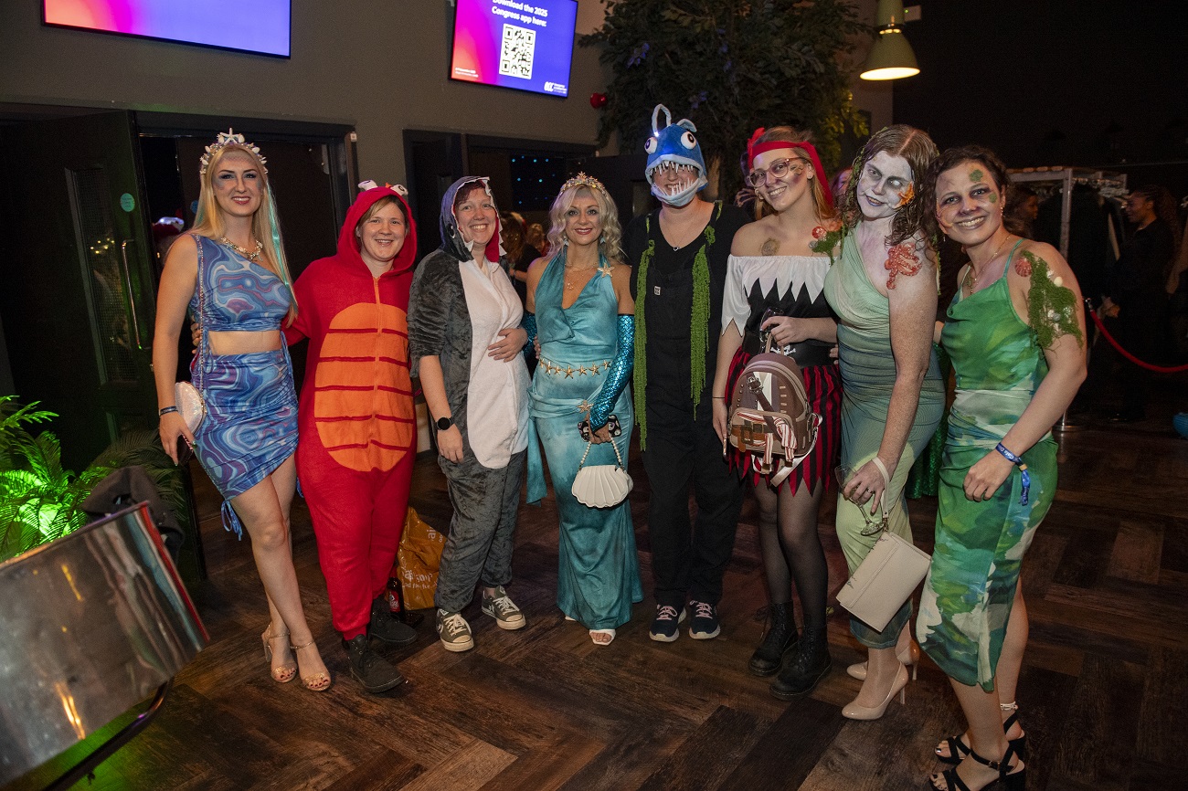 Vets Now team dressed in creative sea-themed costumes, smiling and celebrating together at a staff social event.