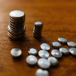 a collection of various sized button batteries