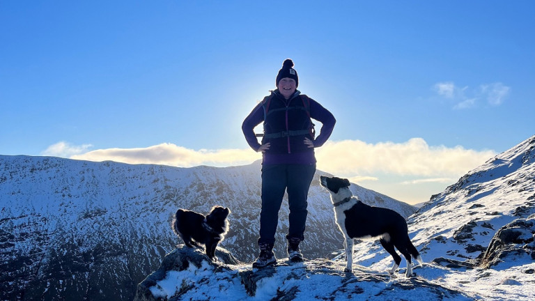 Thumbnail of Vets Now Siobhan Casey on a snowy mountain top with two dogs